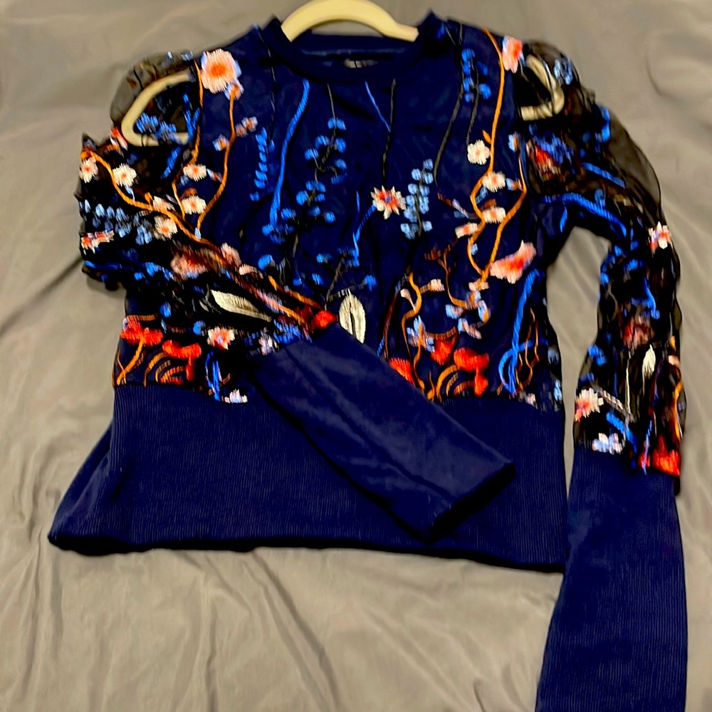 Embroidered sheer blouse with underlays. Colorful and sexy fitted elastic waist.